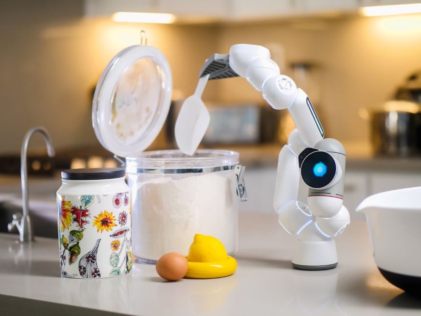A small robot baking something.