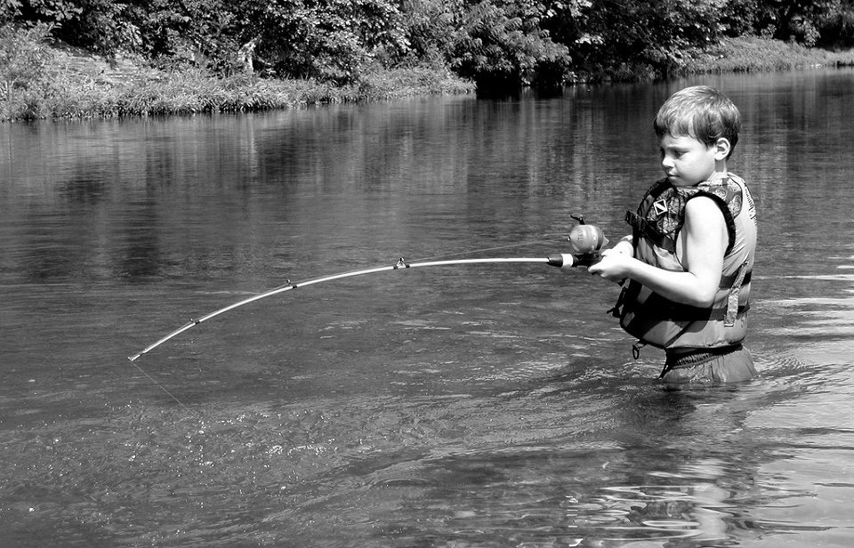 Image, hook your reader, boy fishing. 