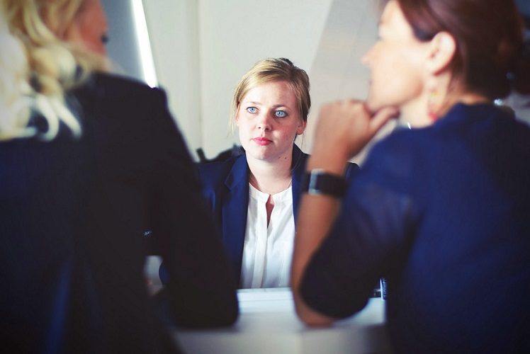 Image, three businesswomen in a meeting.