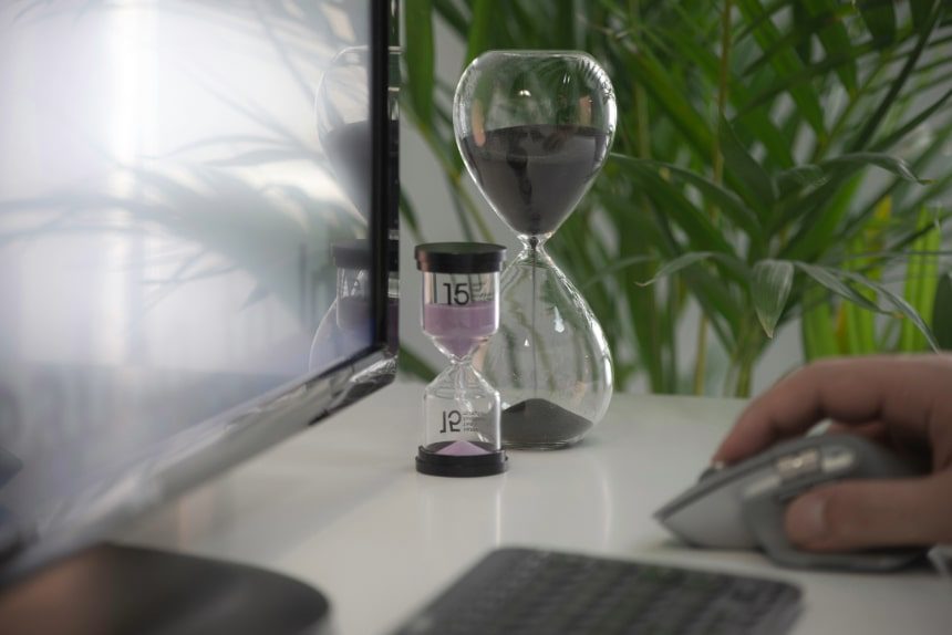 Two hour glass timers on a desk.