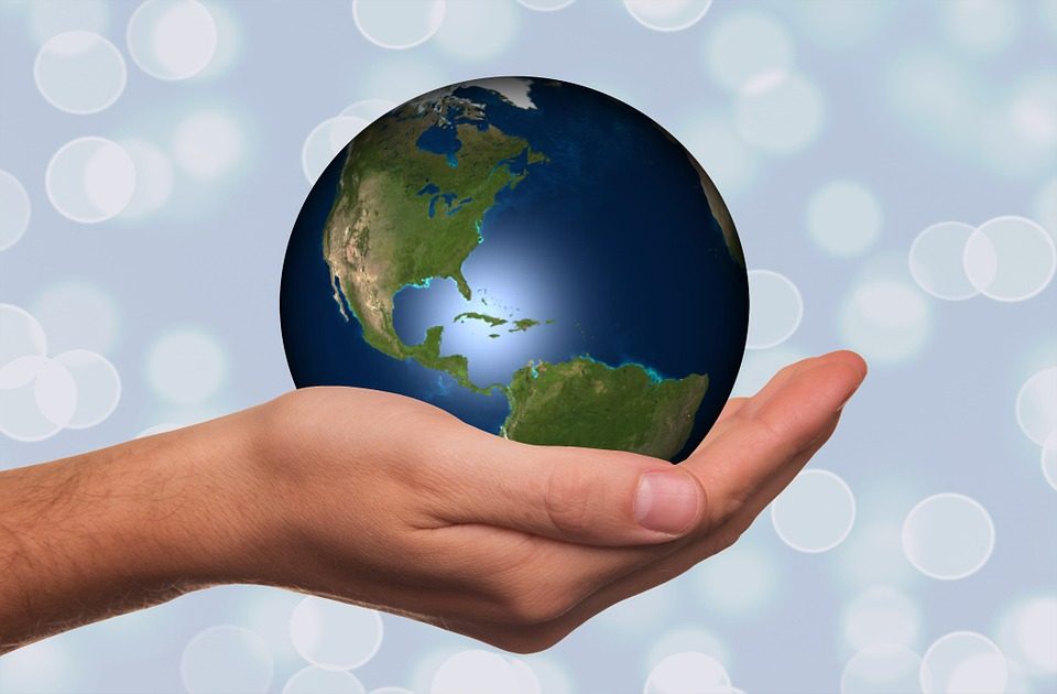 Image, Hand holding a globe.