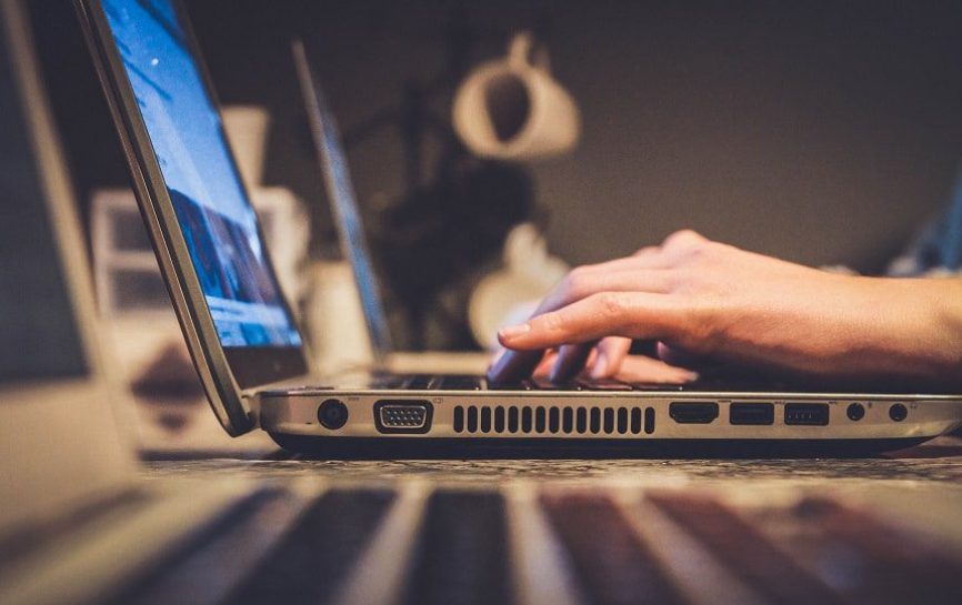 Image, Hands on a laptop computer.