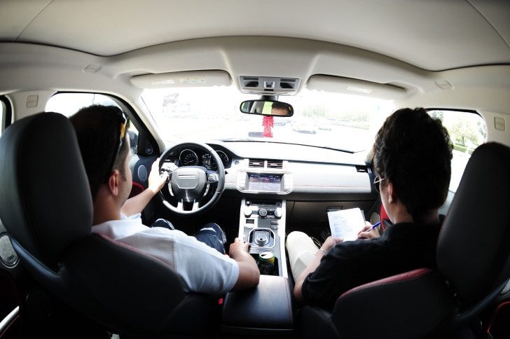 Image, Driver and tester in the the cab of a Land Rover.