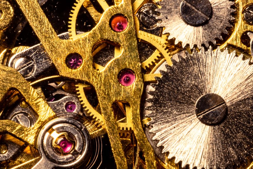 Cogs and gears inside a handmade clock 