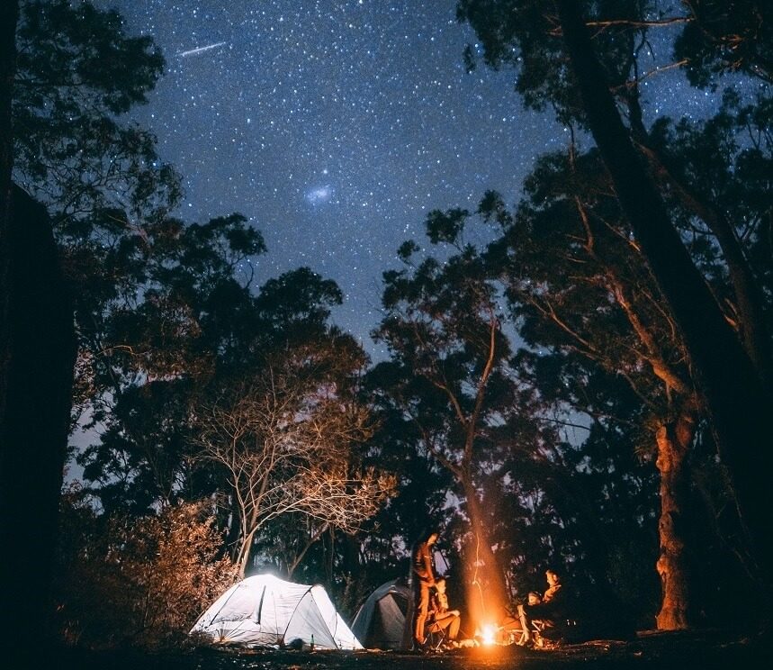 Image, two people camping under a starry sky, storytelling