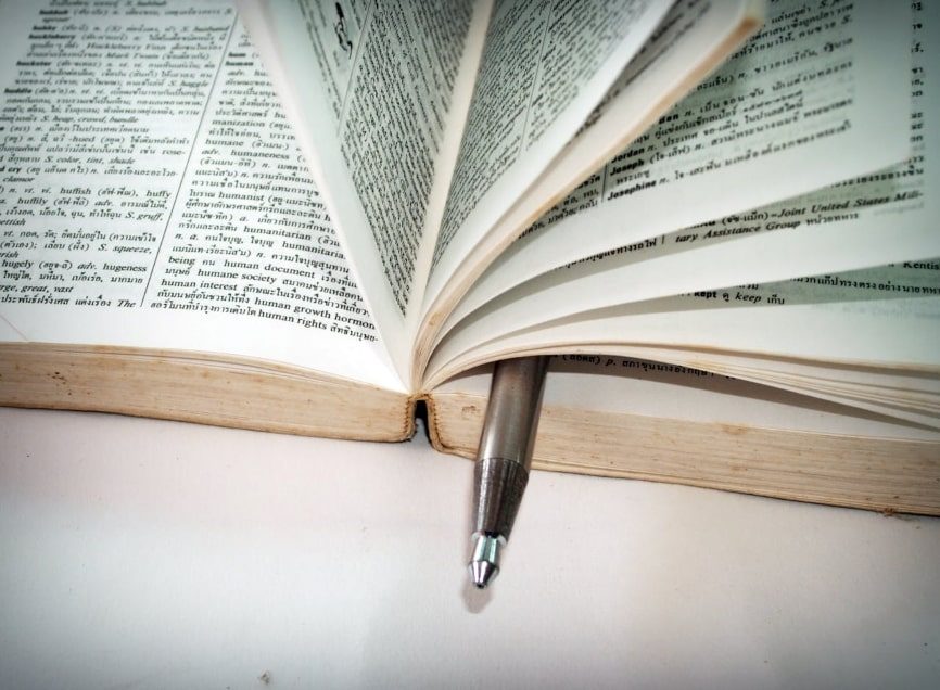 Ballpoint pen placed in book pages