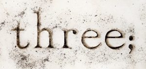 Image of the word 'three', followed by a semicolon.