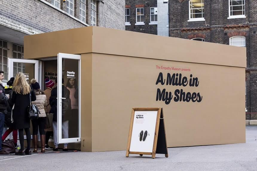 Image, line of people outside the Walk A Mile In My Shoes exhibition