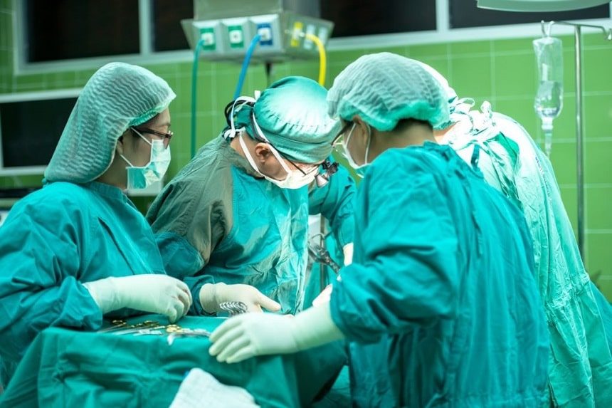 image, surgeons around an operating theatre