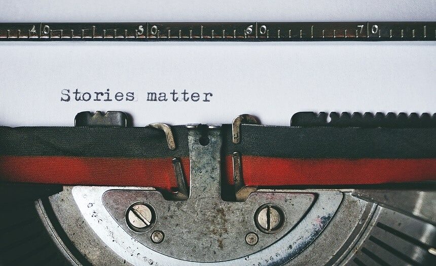 Image, typewriter with a black and red ribbon and a sheet with 'Stories matter; typed on it